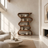 Tall bookshelf made of five stacked open wavy loop tiers in a bright open plan living room