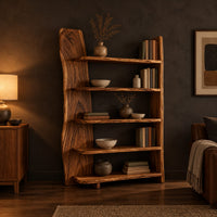 Bookshelf with five shelves and a tall slab side with a wavy outline in a dark living room at golden hour