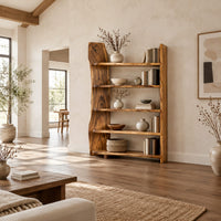 Bookshelf with five shelves and a tall slab side with a wavy outline in a bright open plan living room