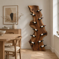 Tall live edge slab wine rack with angled bottle pegs in a Scandinavian dining room with white walls
