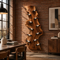 Tall live edge slab wine rack with angled bottle pegs in an industrial loft dining room with exposed brick