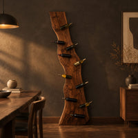 Tall wine rack made from a live edge slab with staggered pegs in a dark dining room at golden hour