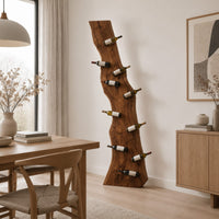 Tall wine rack made from a live edge slab with staggered pegs in a Scandinavian dining room with white walls