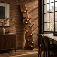 Tall wine rack made from a live edge slab with staggered pegs in an industrial loft dining room with exposed brick