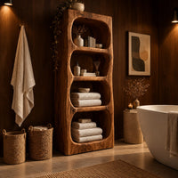 Tall open shelf cabinet with four carved niches and textured grain in an evening bathroom with walnut wall paneling