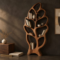 Corner detail of tall single leaf bookshelf with a veined frame and open shelves beside wood, brass and linen samples
