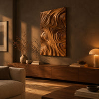 Tall wood wall art panel with sculpted ripples and a ringed knot above a low console in an evening living room