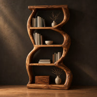 Tall bookshelf with wavy sides, four open shelves and a thick organic frame in a dark studio against a charcoal plaster wall