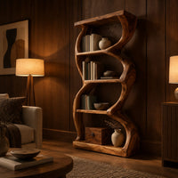 Tall bookshelf with wavy sides, four open shelves and a thick organic frame in an evening living room with walnut wall paneling