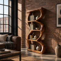 Tall bookshelf with wavy sides, four open shelves and a thick organic frame in an industrial loft living room with exposed brick