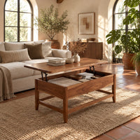 Lift top coffee table with tapered legs and a lower rail frame in a bright living room with arched windows and plants