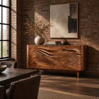 Sideboard with four wave carved doors and tapered legs in an industrial loft dining room with exposed brick