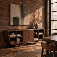 Tapered sideboard with open cubbies on both sides and a wavy base in an industrial loft dining room with exposed brick