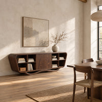 Tapered sideboard with open cubbies on both sides and a wavy base in a bright open plan dining room