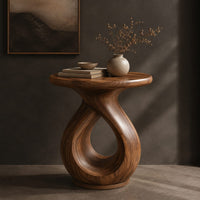 Round side table on a looped teardrop pedestal with a flat disc base, three-quarter view showing the grain