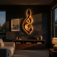 Twisted teardrop note wall sculpture in wood above a low console in an evening living room