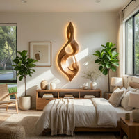 Twisted teardrop note wall sculpture in wood in a bright sunroom with green plants