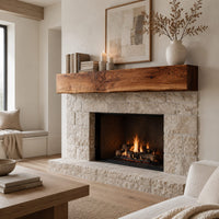 Thick wooden beam mantel shelf with a wavy natural top edge in a Scandinavian living room with white walls
