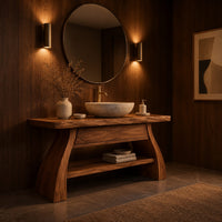 Freestanding vanity with a thick slab top, flared legs and a low shelf in an evening bathroom with walnut wall paneling