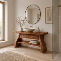 Freestanding vanity with a thick slab top, flared legs and a low shelf in a Scandinavian bathroom with white walls