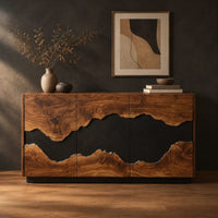 Three door sideboard with a wavy black center band and a plinth base in a dark studio against a charcoal plaster wall