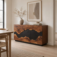 Three door sideboard with a wavy black center band and a plinth base in a Scandinavian dining room with white walls