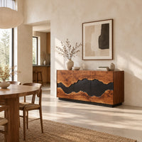 Three door sideboard with a wavy black center band and a plinth base in a bright open plan dining room