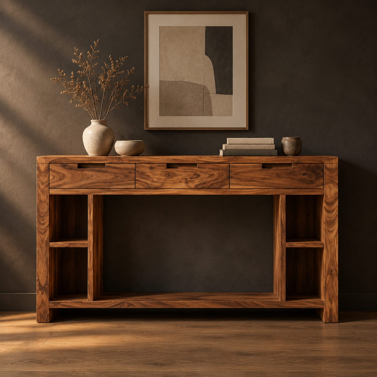 Console table with three drawers, open side cubbies and a lower shelf in a dark studio against a charcoal plaster wall