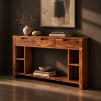 Console table with three drawers, open side cubbies and a lower shelf, three-quarter view showing the grain