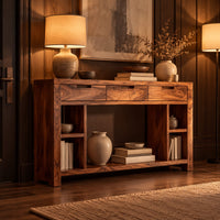 Console table with three drawers, open side cubbies and a lower shelf in an evening entryway with walnut wall paneling