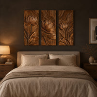 Set of three tall wooden panels carved with lotus flowers in relief above a bed in a dusk lit bedroom