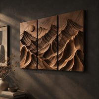 Three panel carved mountain relief wall art with a sun disc, three-quarter view showing the carved depth