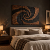 Three panel spiral wall art with a carved black swirl on warm wood above a bed in a dusk lit bedroom