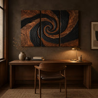 Three panel spiral wall art with a carved black swirl on warm wood above a desk in a dark study corner