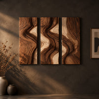 Three panel wall art with flowing bands of dark and light wood grain on a dark charcoal plaster wall