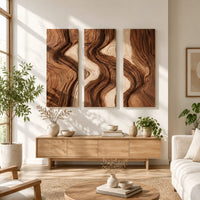 Three panel wall art with flowing bands of dark and light wood grain in a bright sunroom with green plants