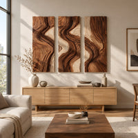 Three panel wall art with flowing bands of dark and light wood grain above a light oak sideboard in daylight