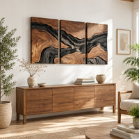Three panel wood grain wall art with a dark flowing river band in a bright sunroom with green plants