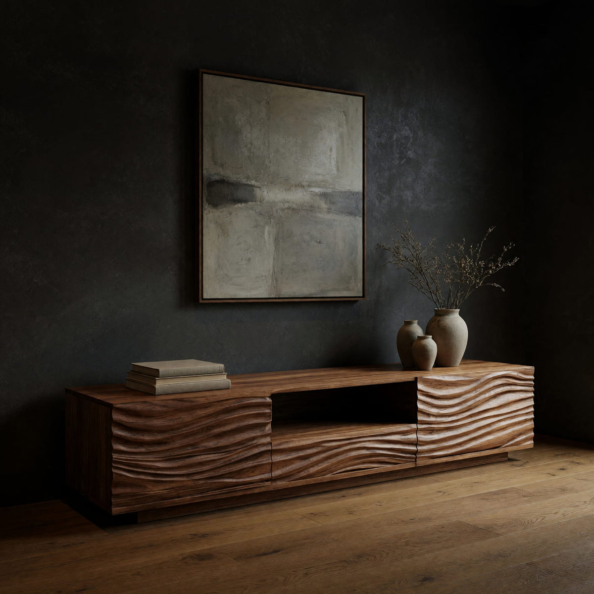 Media cabinet with wave carved doors around an open niche in a dark studio against a charcoal wall