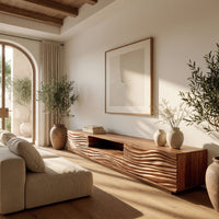 Media cabinet with wave carved doors around an open niche in a bright modern living room
