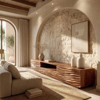 Media cabinet with wave carved doors around an open niche in an open plan space in daylight