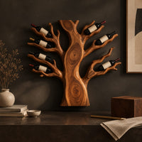 Corner detail of carved tree shaped wine rack with a thick trunk and branches beside wood, brass and linen samples