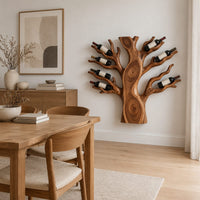 Carved tree shaped wine rack with a thick trunk and branches in a Scandinavian dining room with white walls