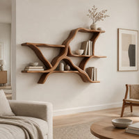 Wall shelves in a branching limb shape with uneven tiers in a Scandinavian living room with white walls