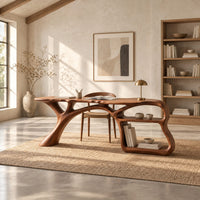 Desk on a branching limb leg with an open shelf frame at one end in a bright open plan home office