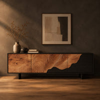 Low tv stand with tree ring carving, a dark wave panel and birds in a dark studio against a charcoal plaster wall