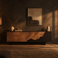 Low tv stand with tree ring carving, a dark wave panel and birds in a dark living room at golden hour