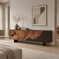 Low tv stand with tree ring carving, a dark wave panel and birds in a Scandinavian living room with white walls