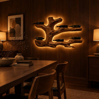 Tree root wine bottle holder with gnarled branching arms in an evening dining room with walnut wall paneling