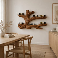 Tree root wine bottle holder with gnarled branching arms in a Scandinavian dining room with white walls